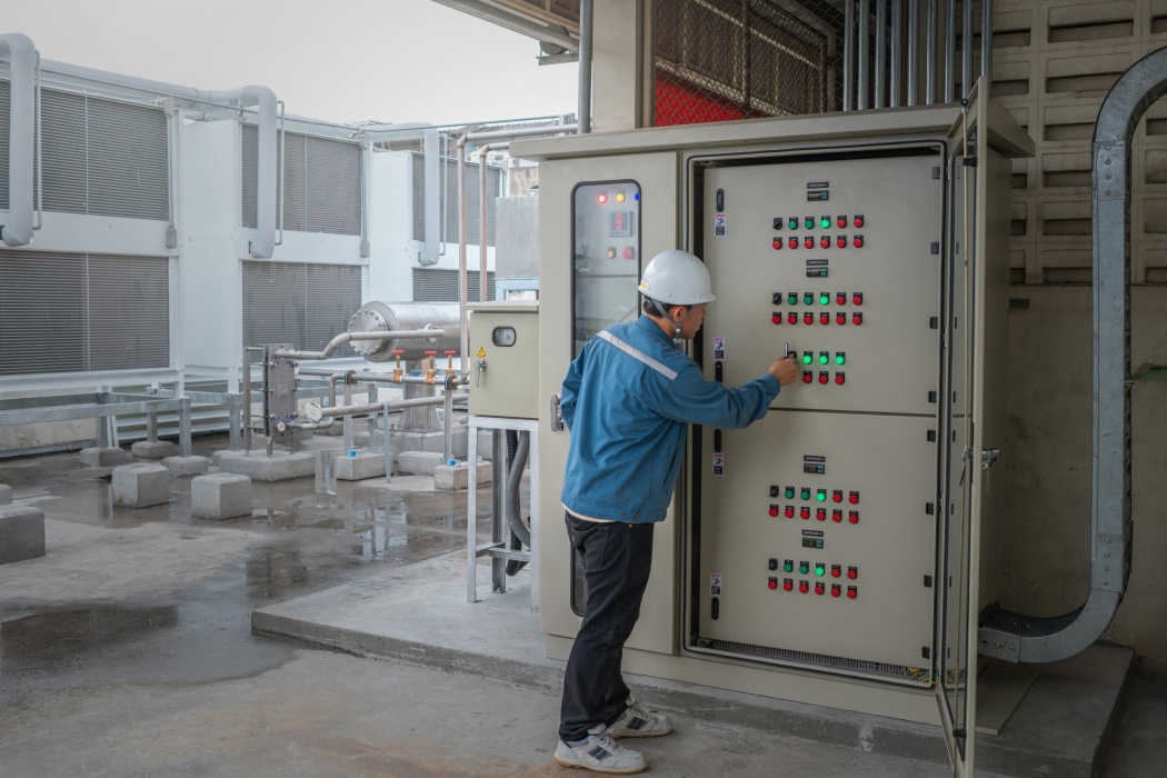 energy engineer checking temp of refrigeration