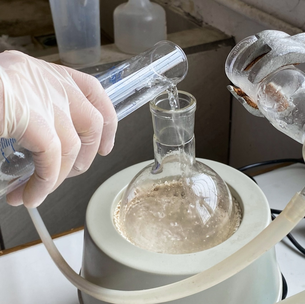 A lab tech wearing protective gloves