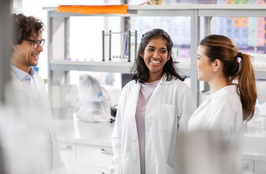 female and male scientists collaborating in the lab