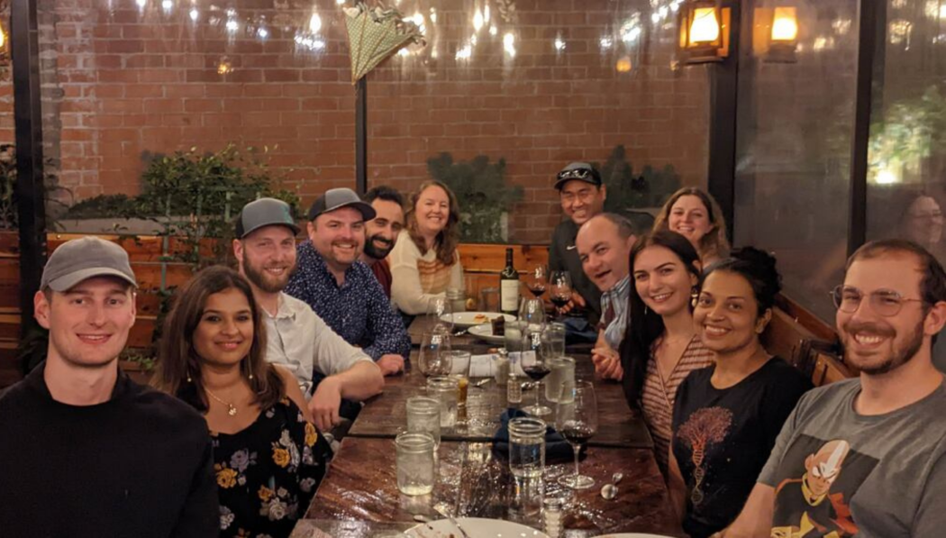 group photo of my green lab employees around a dinner table